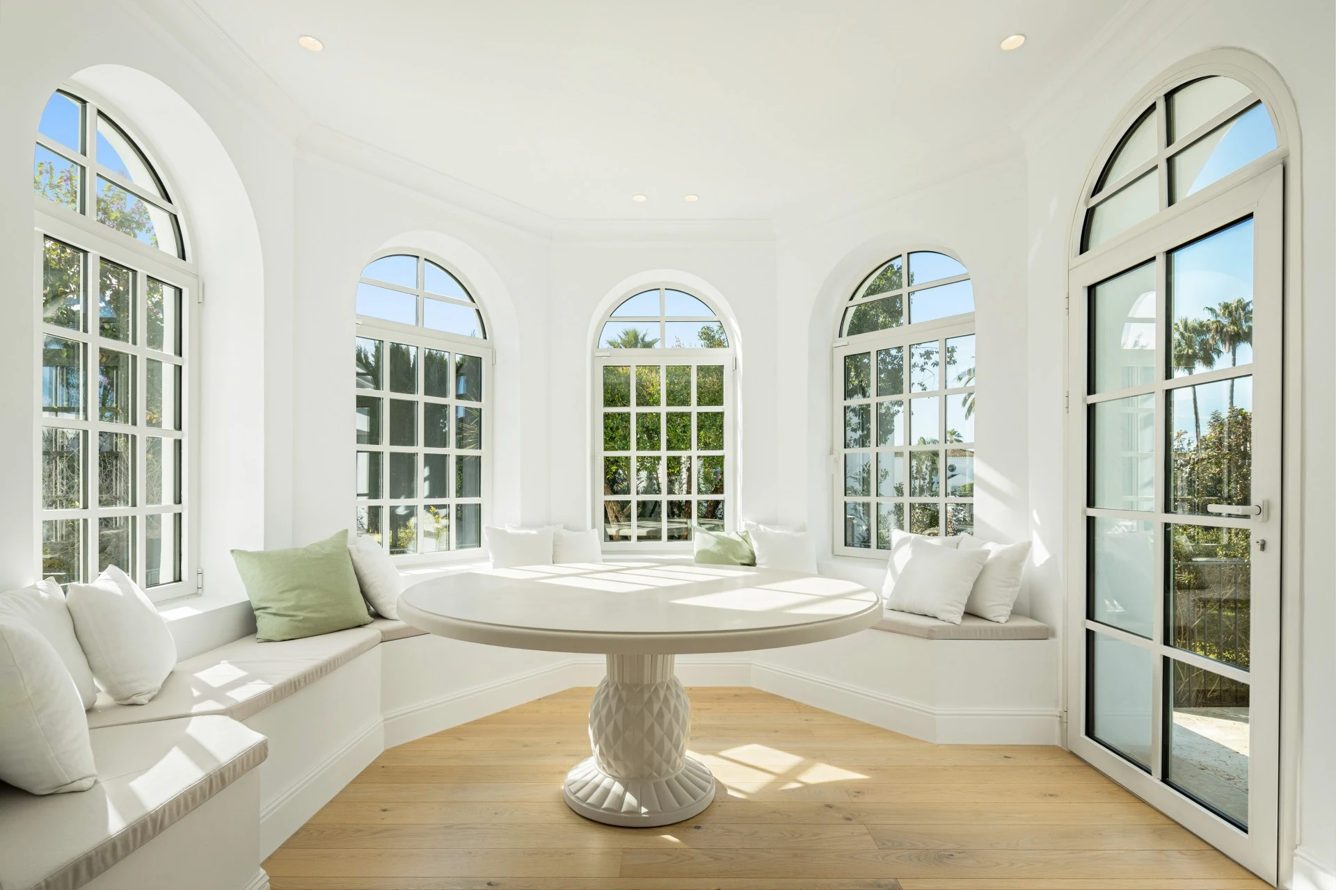 Circular sitting room with tall arched windows
