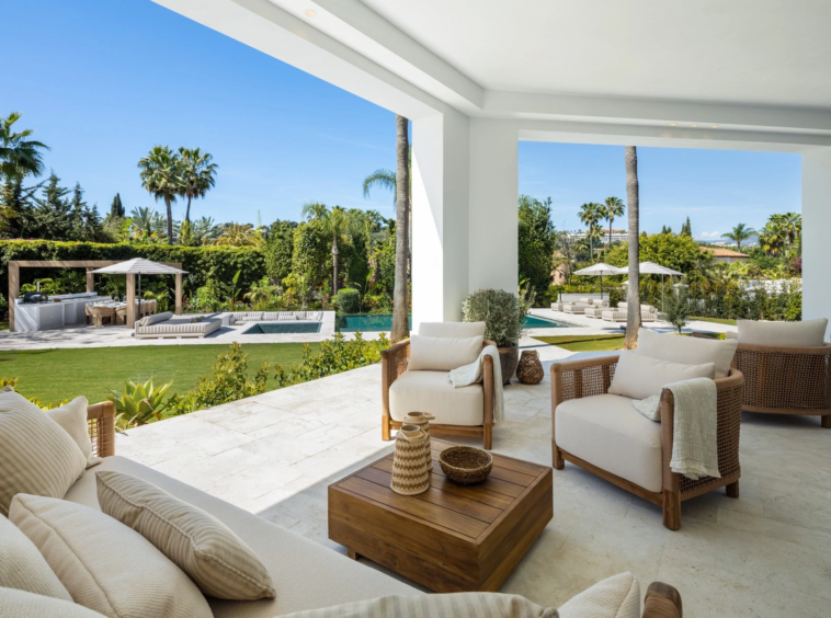 Covered terrace overlooking the private garden and pool