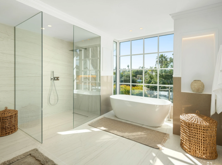 Bathroom with freestanding bathtub and walk-in shower