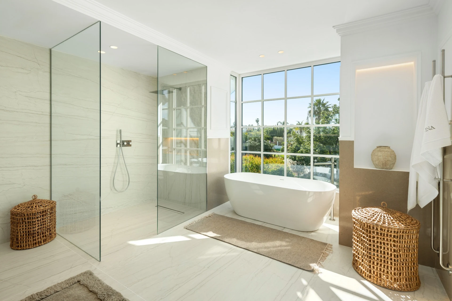 Bathroom with freestanding bathtub and walk-in shower