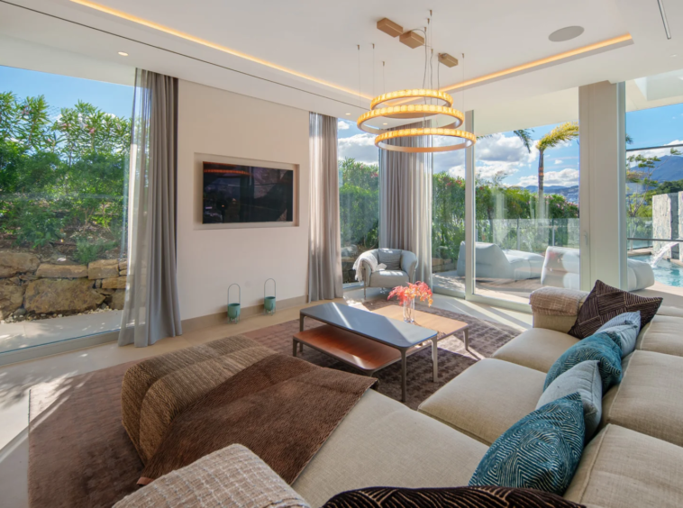 Open-plan living room with floor-to-ceiling windows