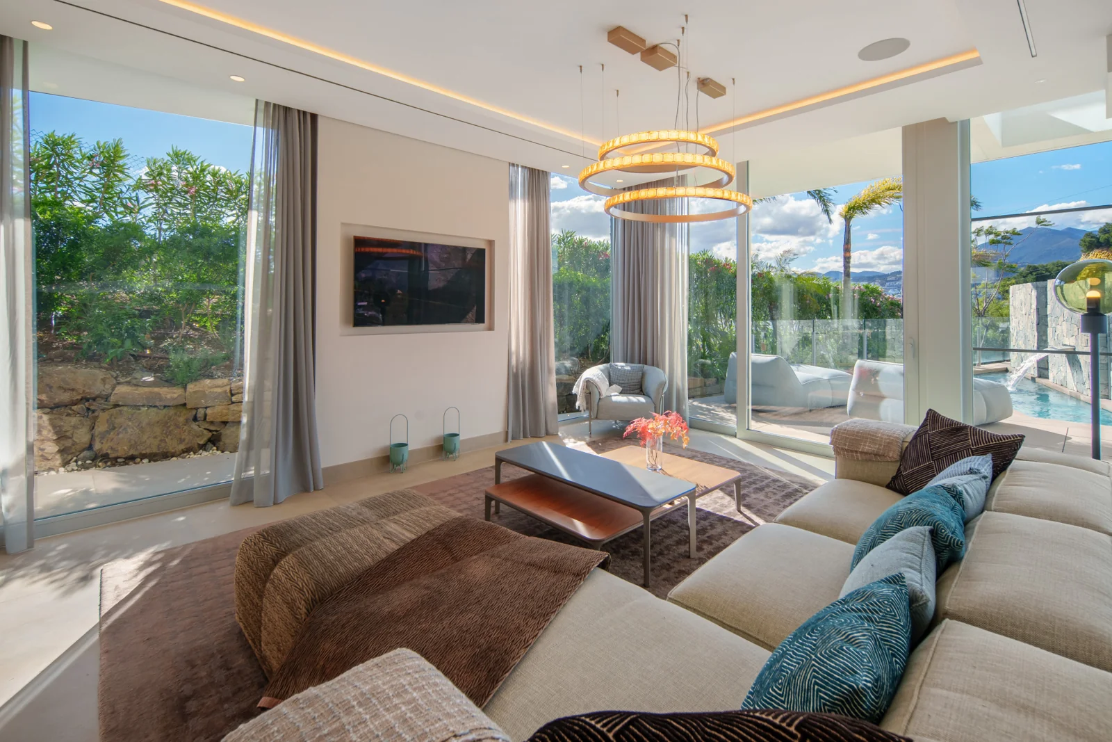 Open-plan living room with floor-to-ceiling windows