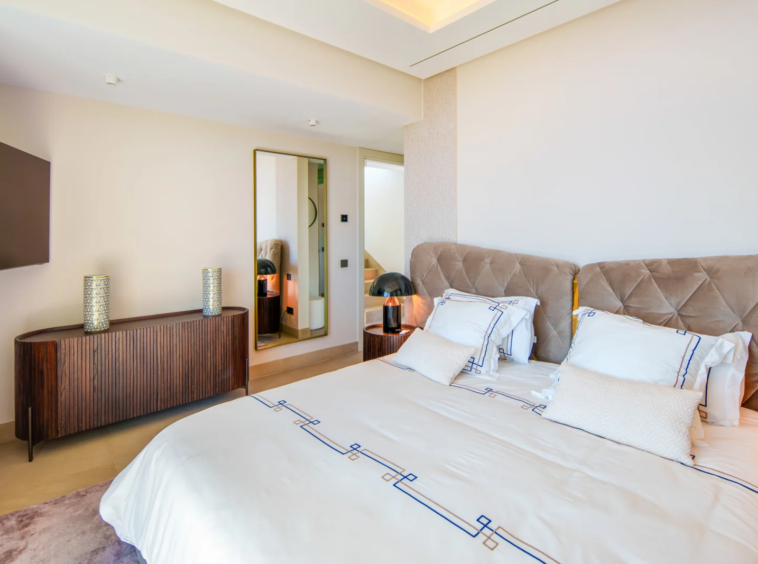 Principal bedroom with warm neutral finishes
