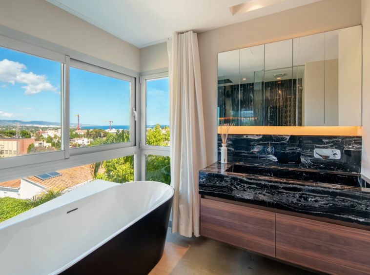 Bathroom with freestanding bath and open views
