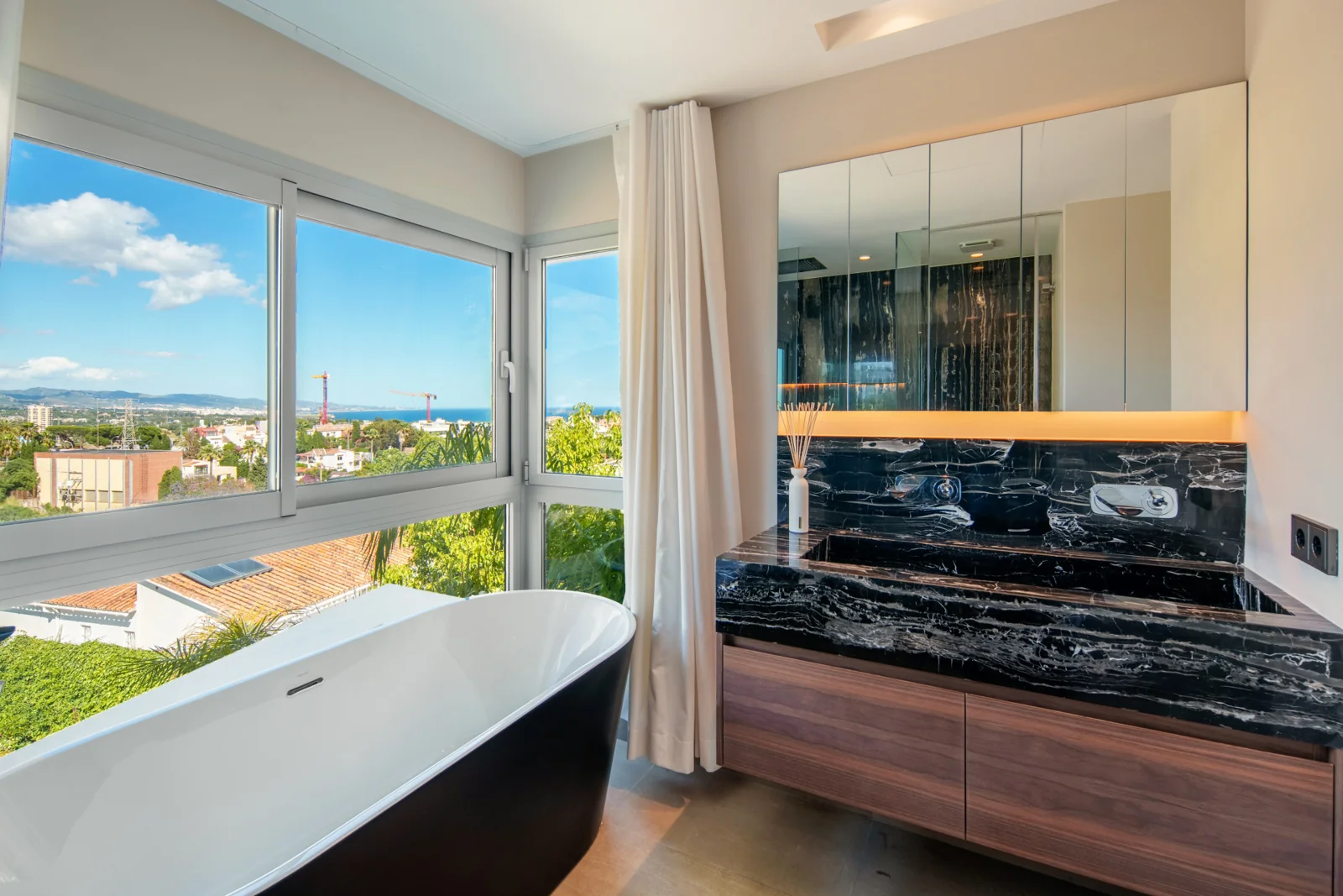 Bathroom with freestanding bath and open views