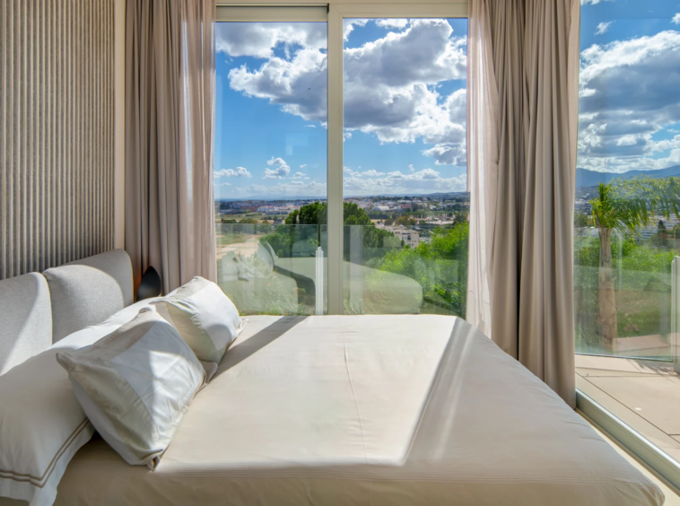 Guest bedroom with large windows