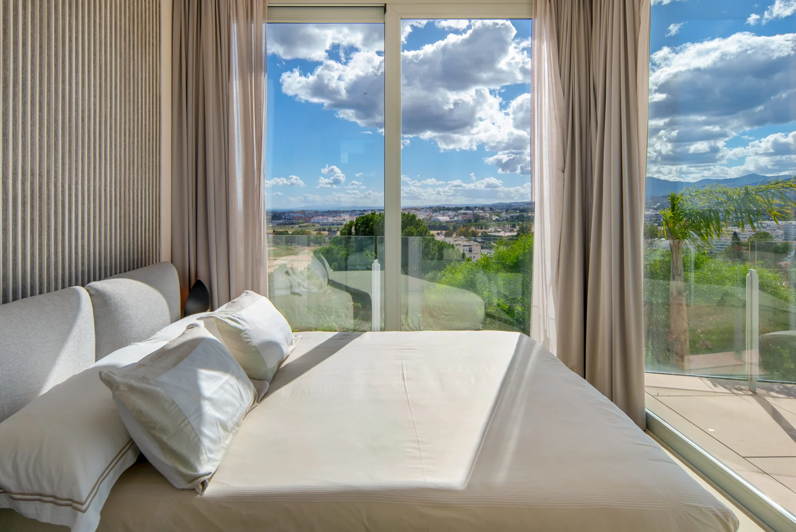 Guest bedroom with large windows