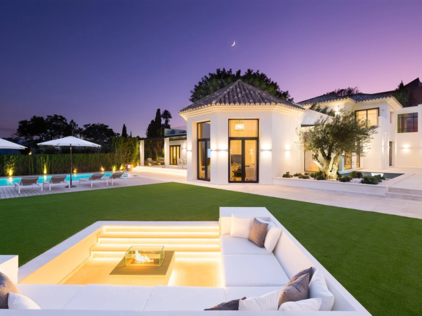 Five-bedroom villa with garden and private pool at dusk in Nueva Andalucia