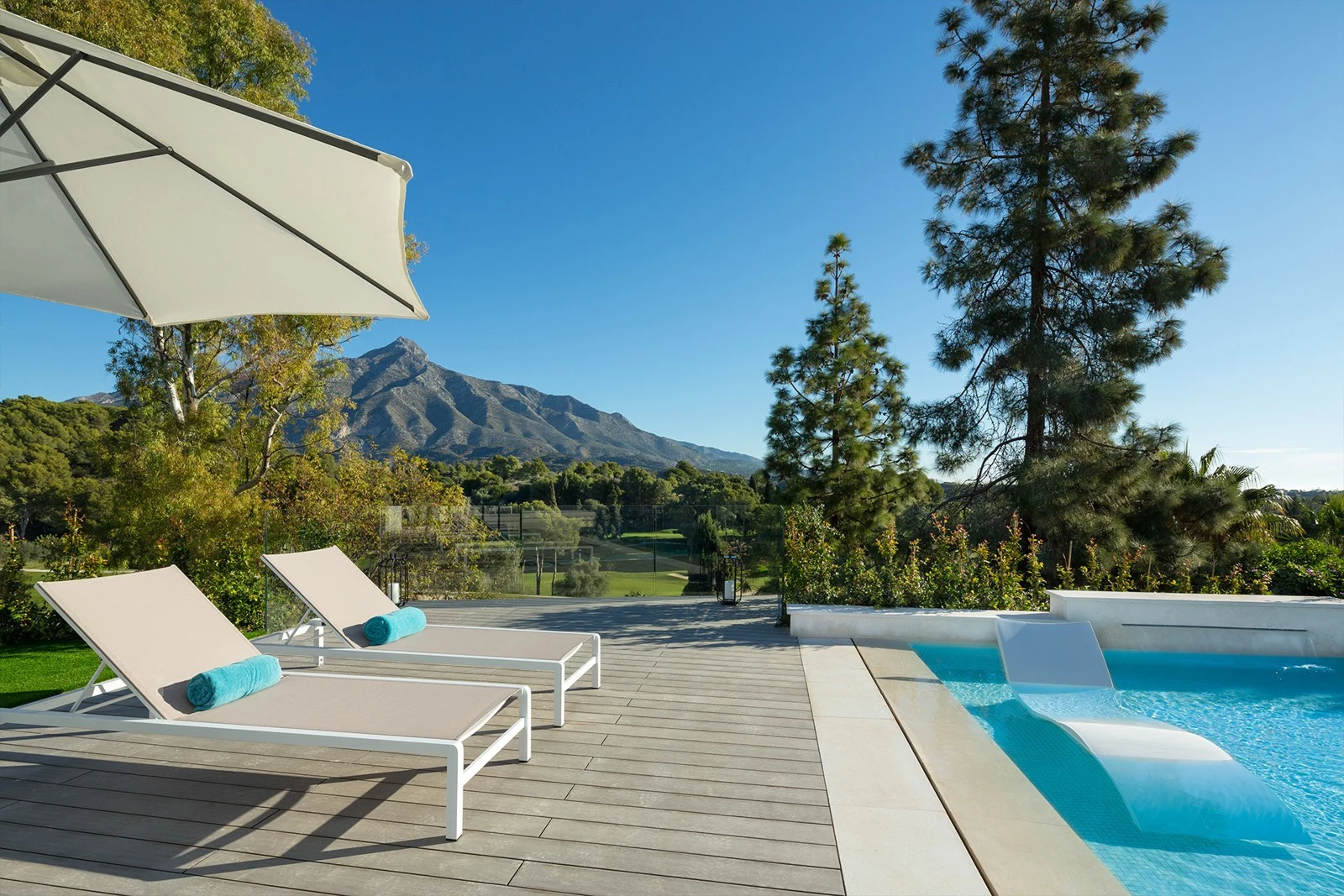 Private pool terrace overlooking the golf course and mountains