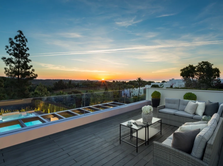 Upper terrace with views over the pool and golf course