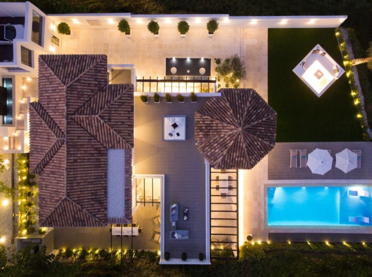 Aerial view of the villa and private pool at night