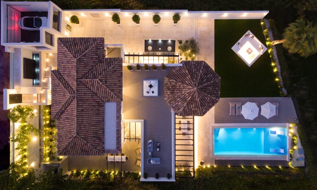 Aerial view of the villa and private pool at night