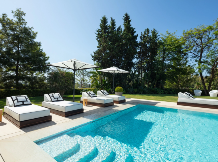 Poolside sun loungers beside the private swimming pool