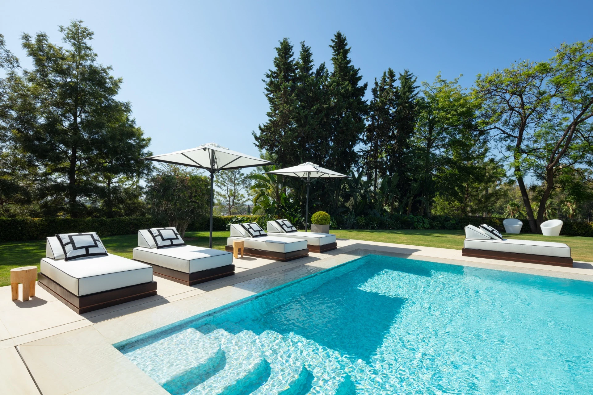Poolside sun loungers beside the private swimming pool