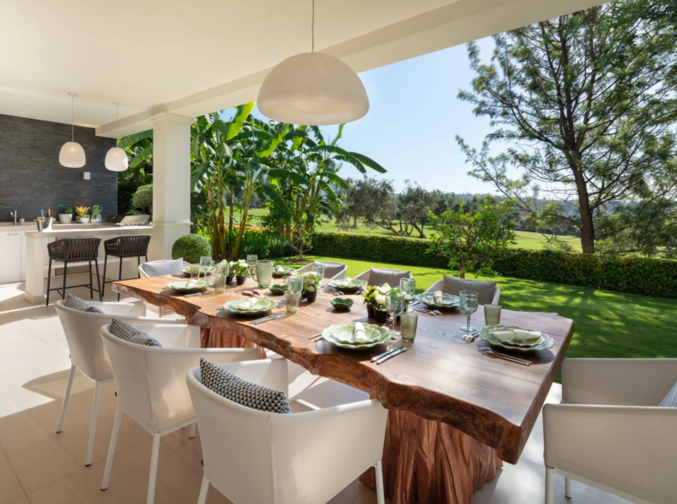 Outdoor dining table overlooking the landscaped garden