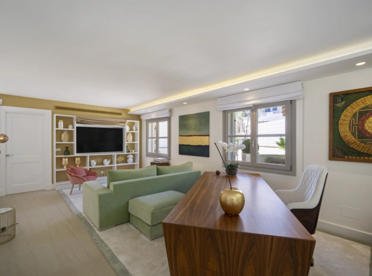 Lounge with television and built in shelving