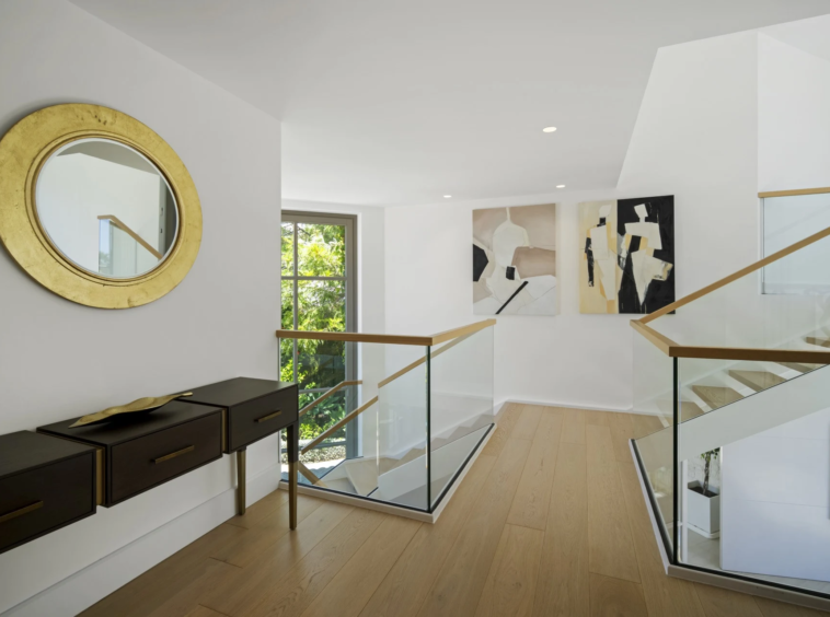 Staircase landing with glass balustrade