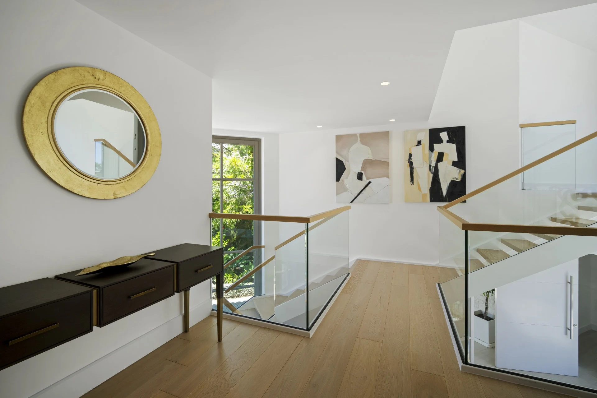 Staircase landing with glass balustrade