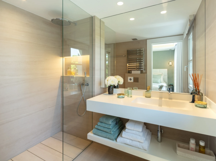 Guest bathroom with stone vanity and large mirror
