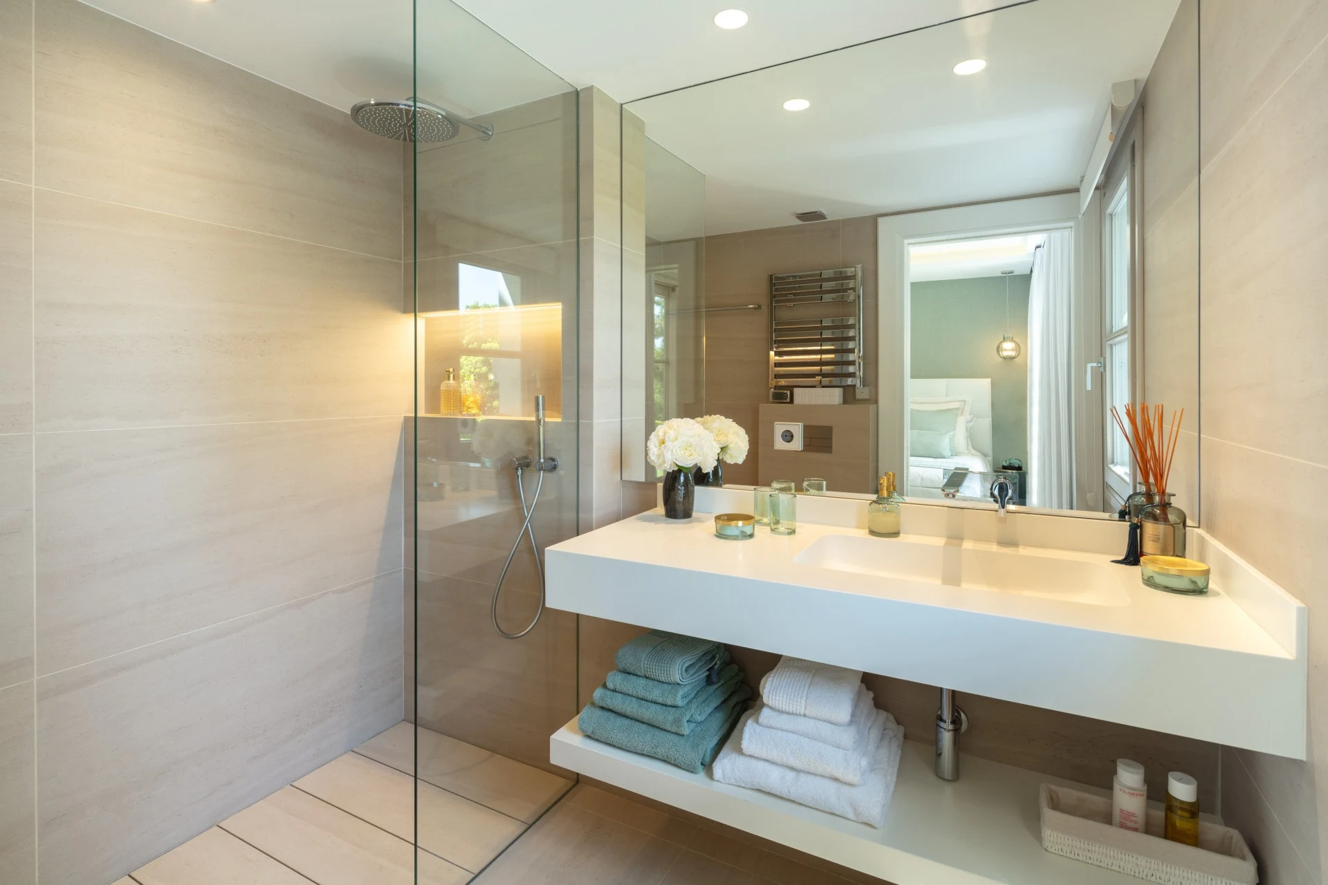 Guest bathroom with stone vanity and large mirror