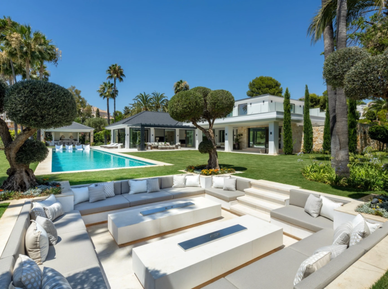 Private outdoor pool and sunken seating area in a landscaped garden