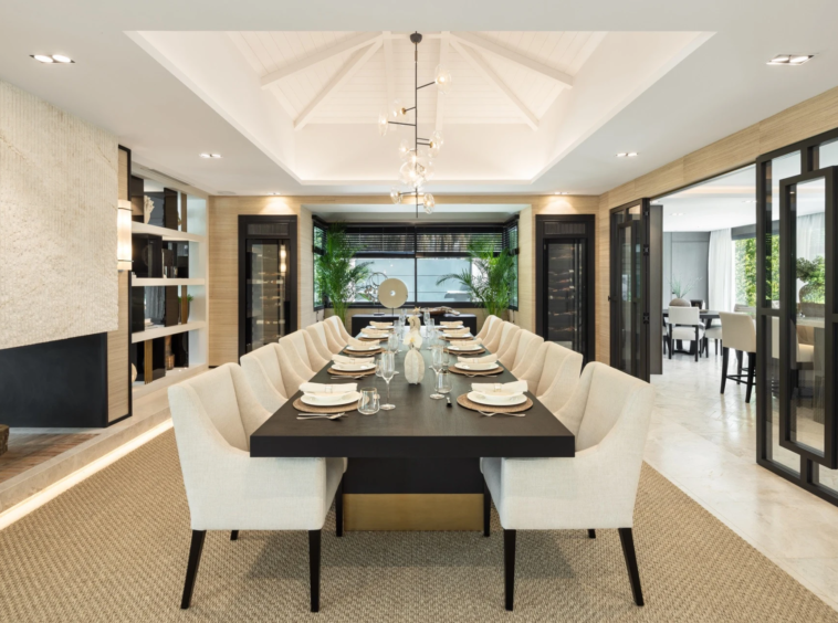 Dining room with a long table and garden-facing windows