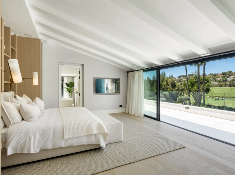 Principal bedroom opening to a golf-view terrace