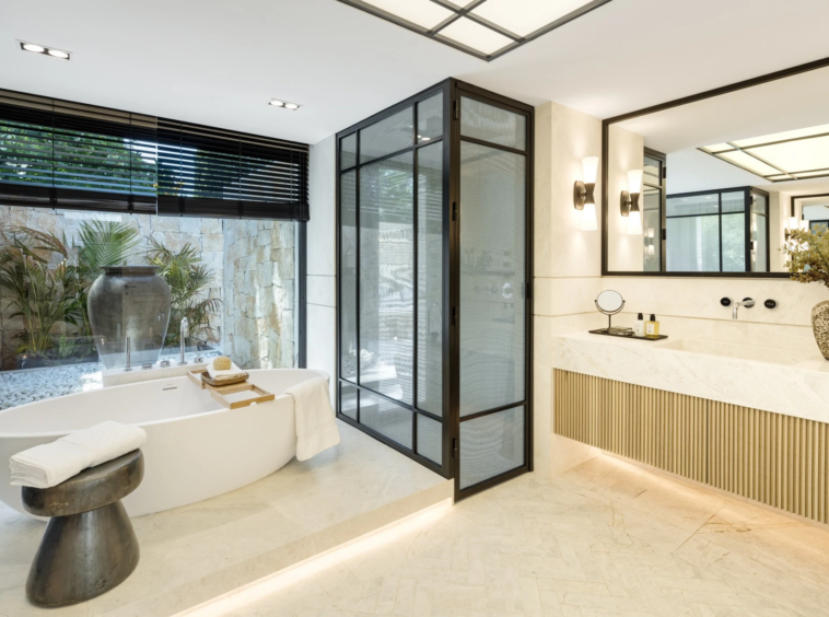 Bathroom with glazed shower enclosure and freestanding bath
