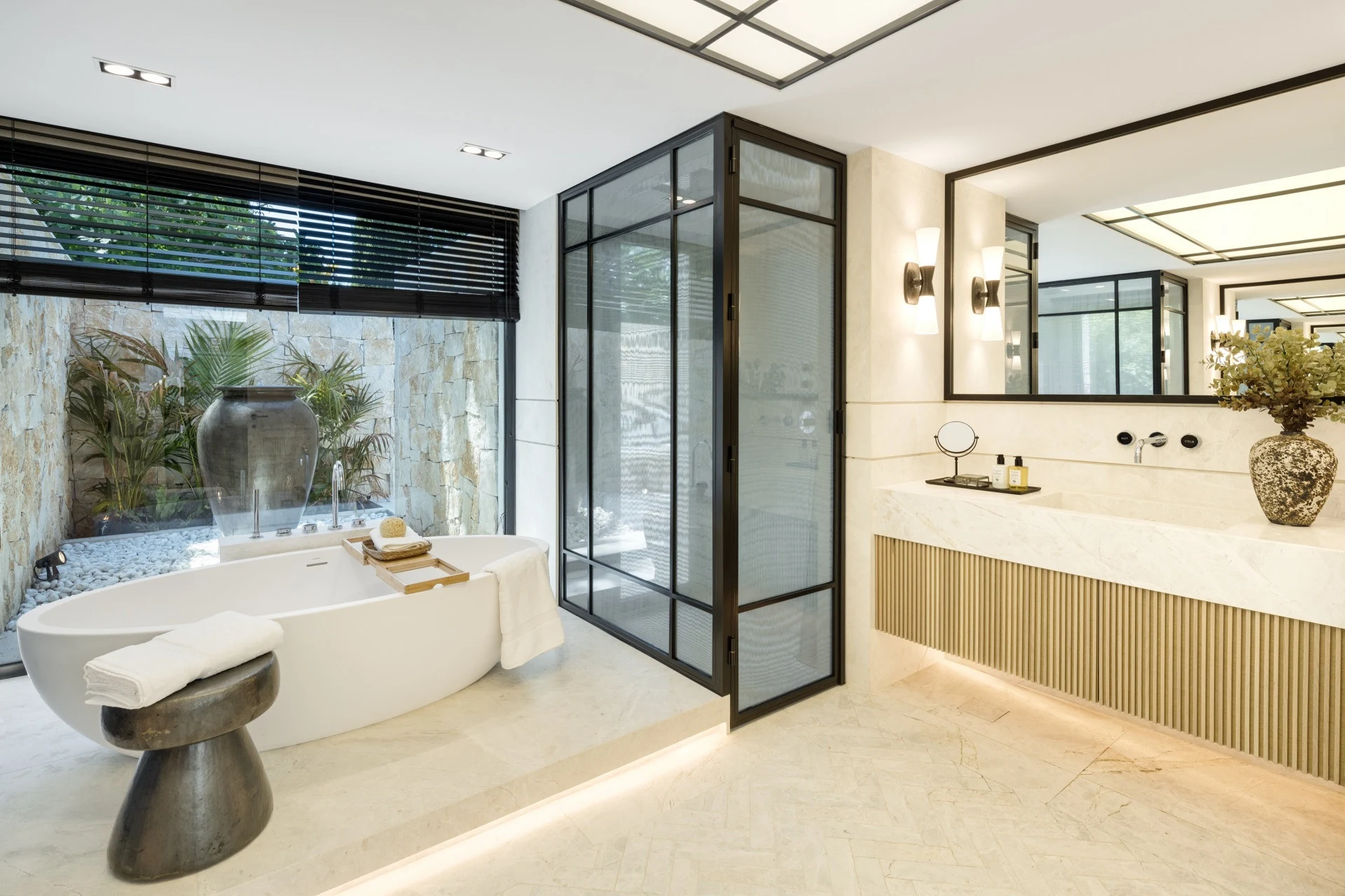 Bathroom with glazed shower enclosure and freestanding bath