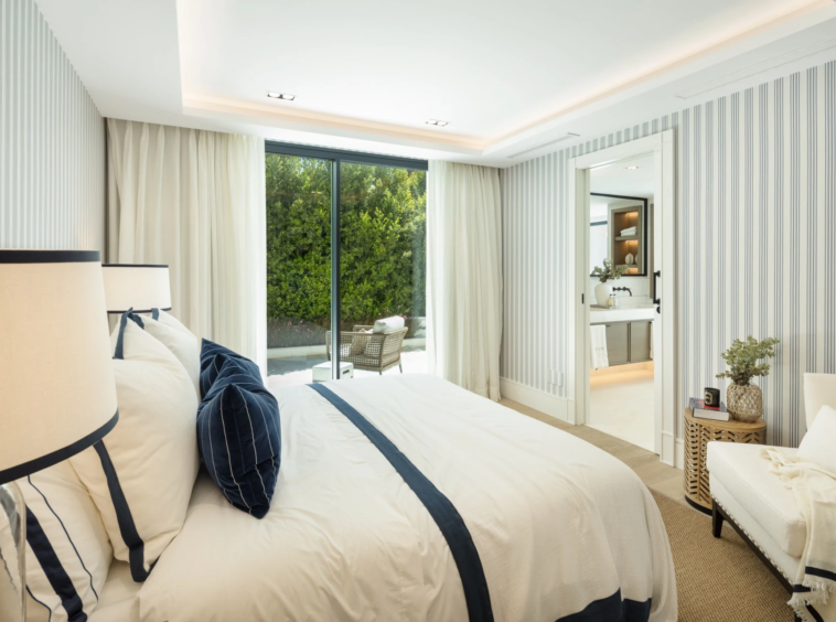 Guest bedroom with upholstered bed and fitted storage