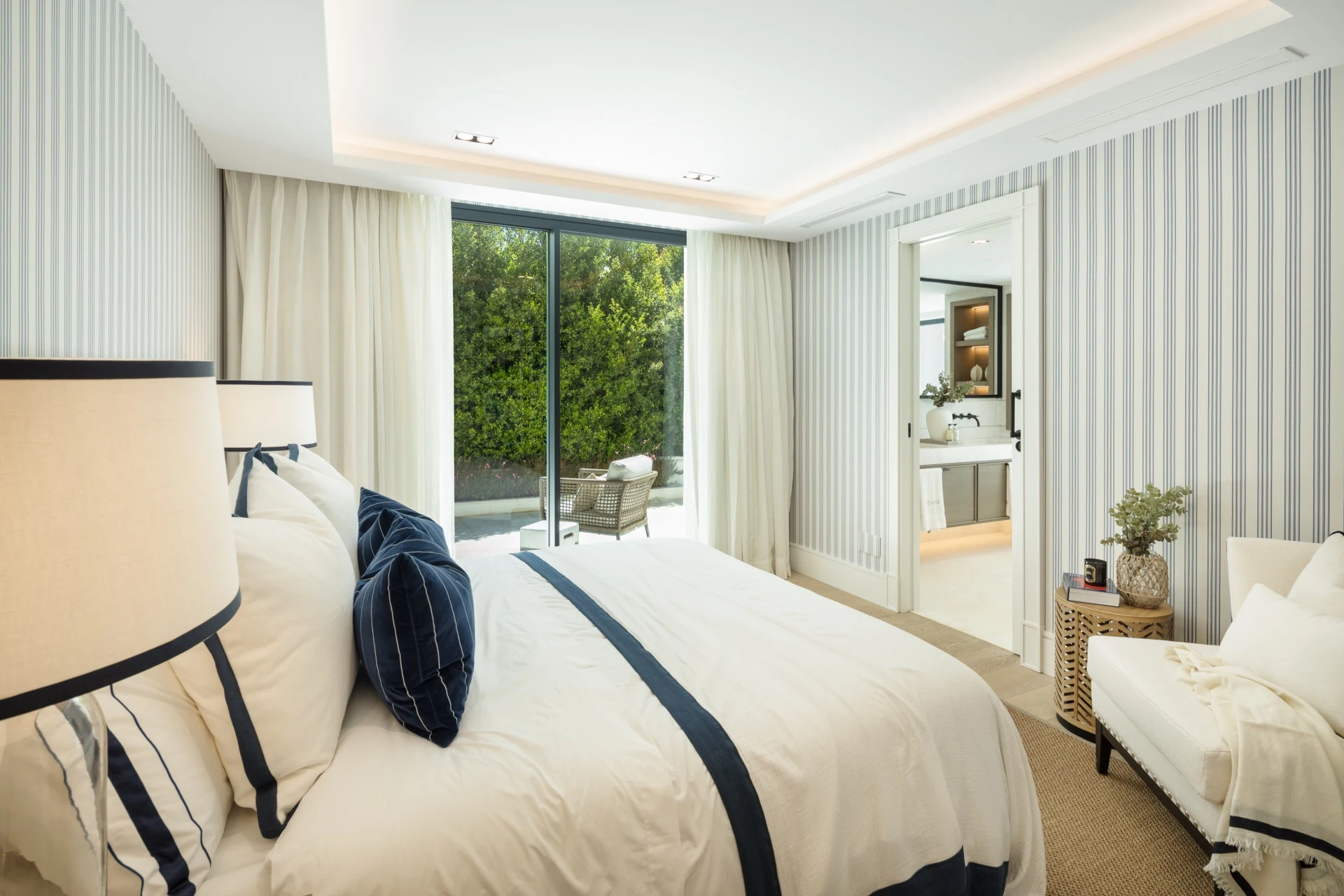Guest bedroom with upholstered bed and fitted storage
