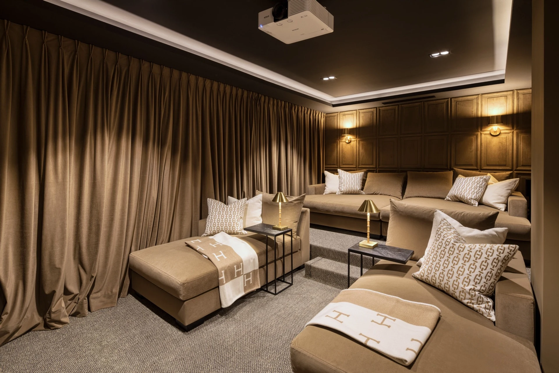 Private cinema with tiered lounge seating