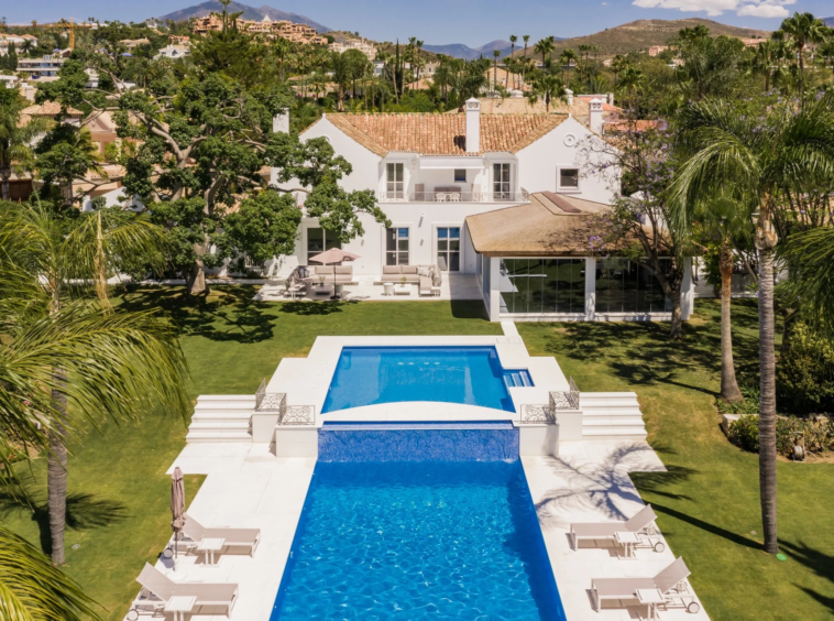 Aerial view of the villa and two-section swimming pool