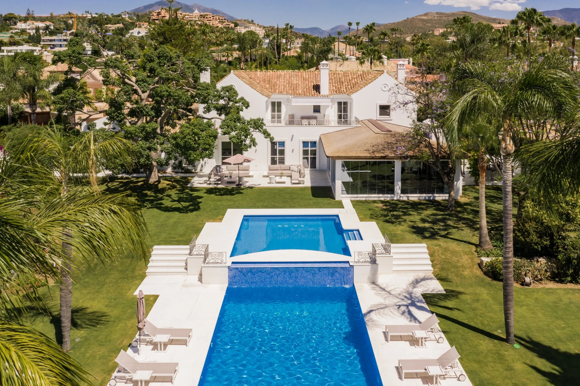 Aerial view of the villa and two-section swimming pool