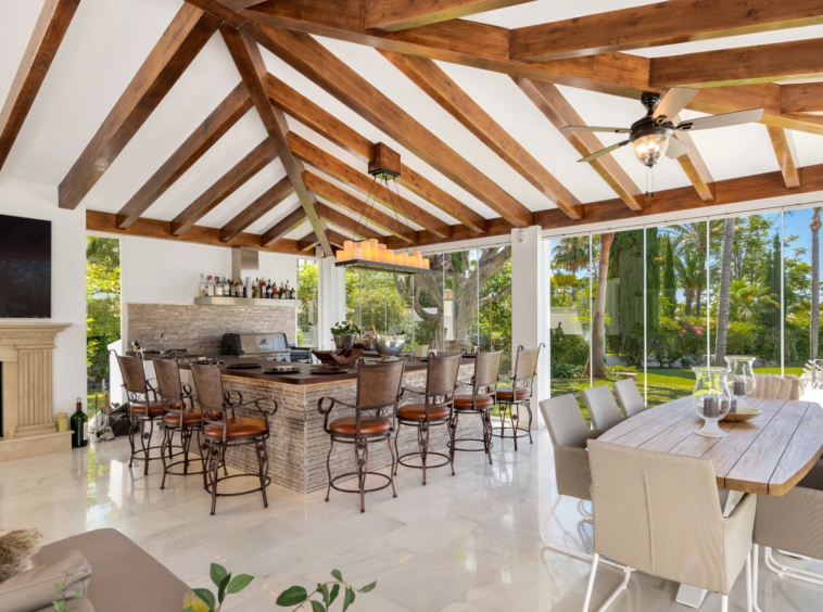 Bright lounge and bar beneath a timber-beamed ceiling