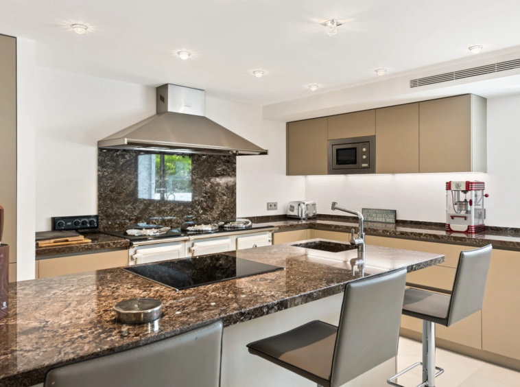 Modern kitchen with stone worktops and island