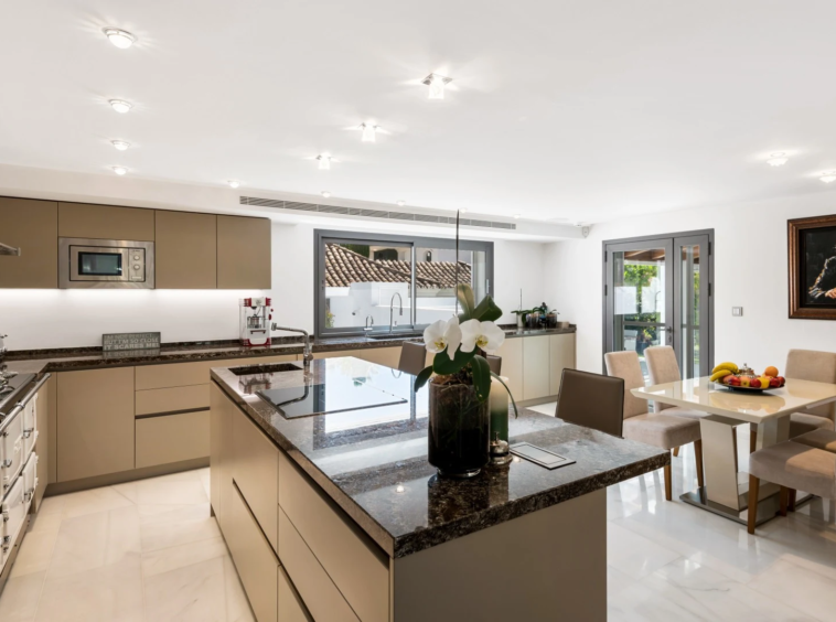 Kitchen and breakfast dining area opening towards the garden