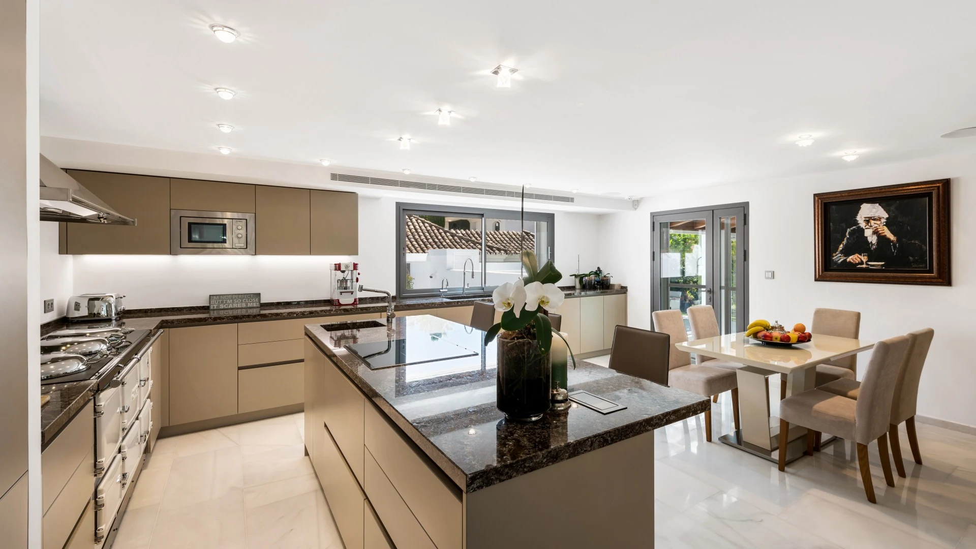 Kitchen and breakfast dining area opening towards the garden