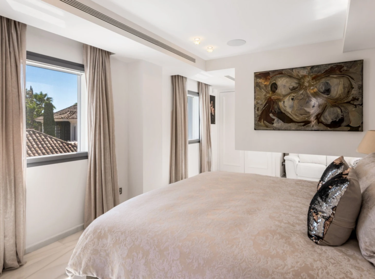 Guest suite with terrace doors and neutral furnishings