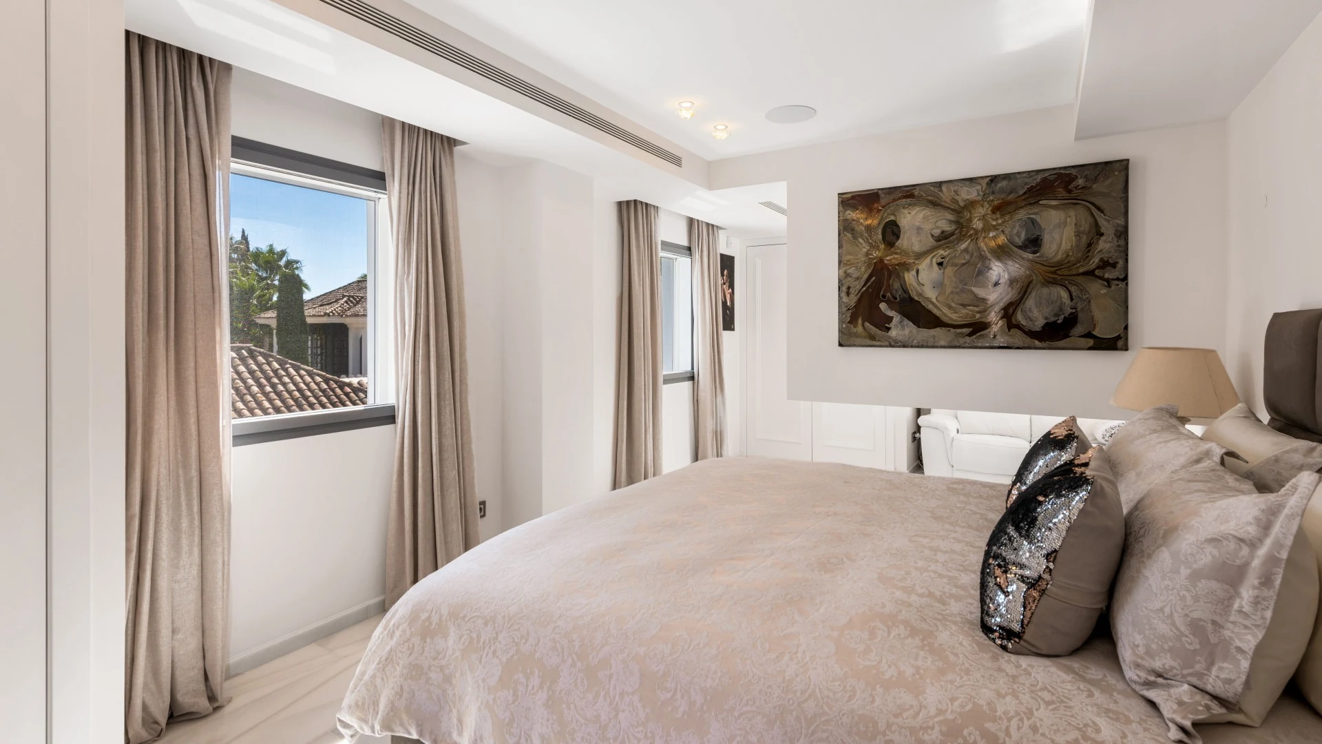Guest suite with terrace doors and neutral furnishings