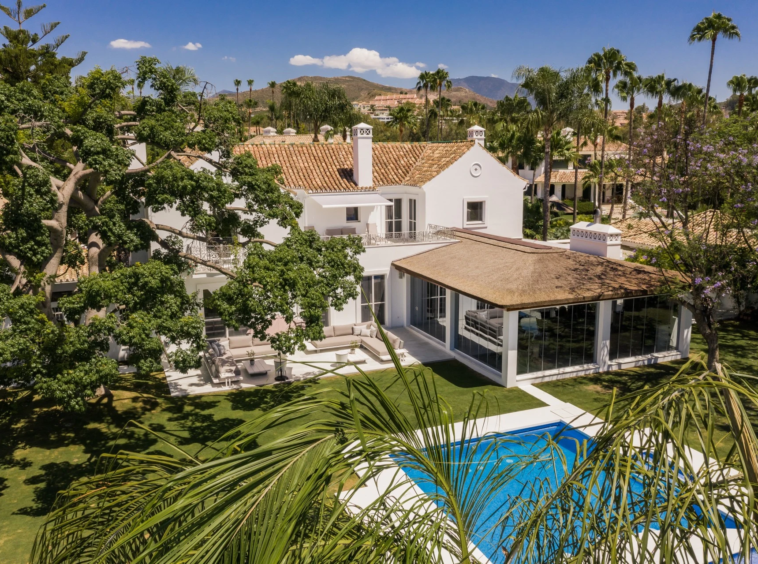 Aerial view of landscaped gardens and pool terraces