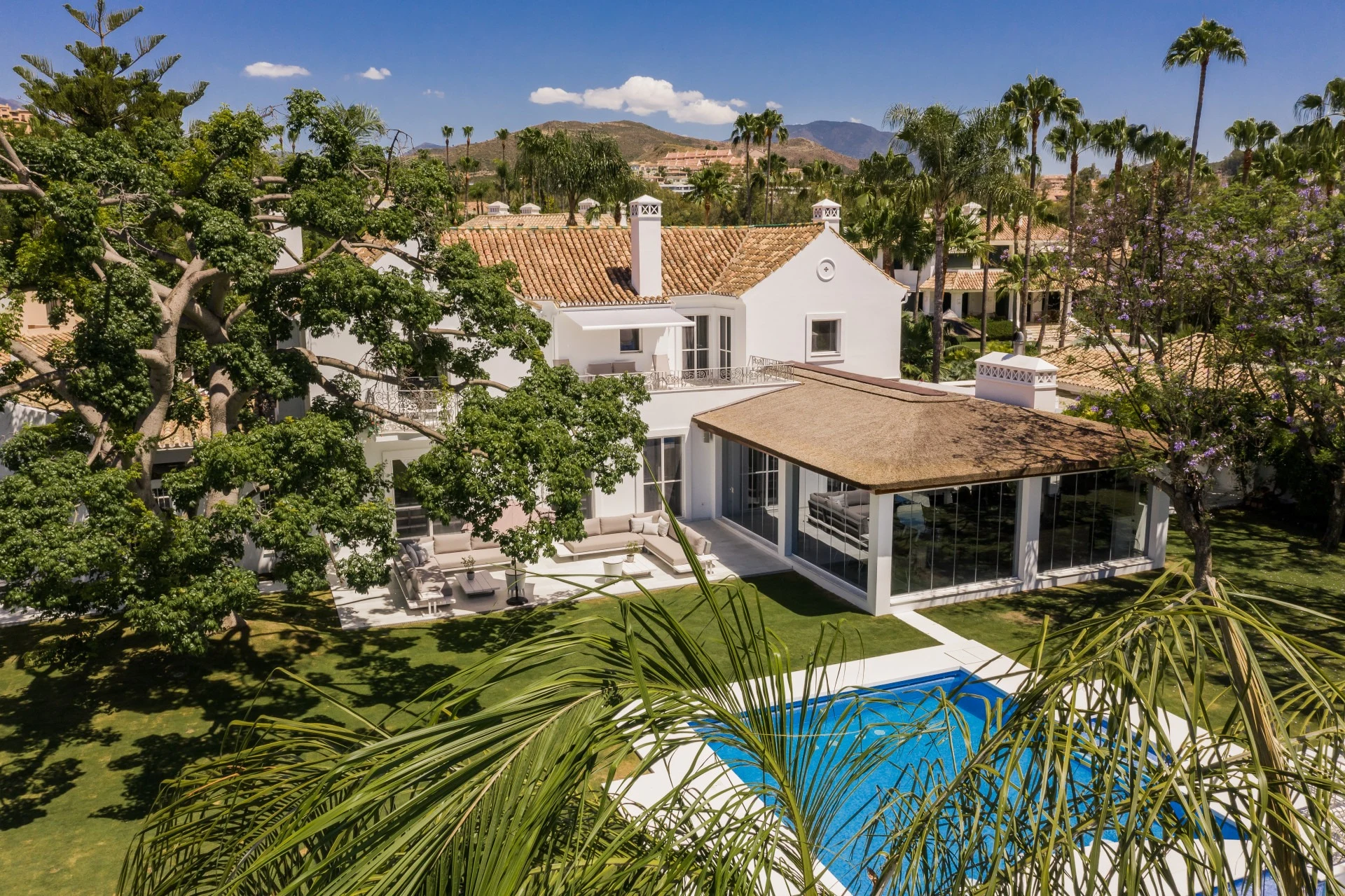 Aerial view of landscaped gardens and pool terraces