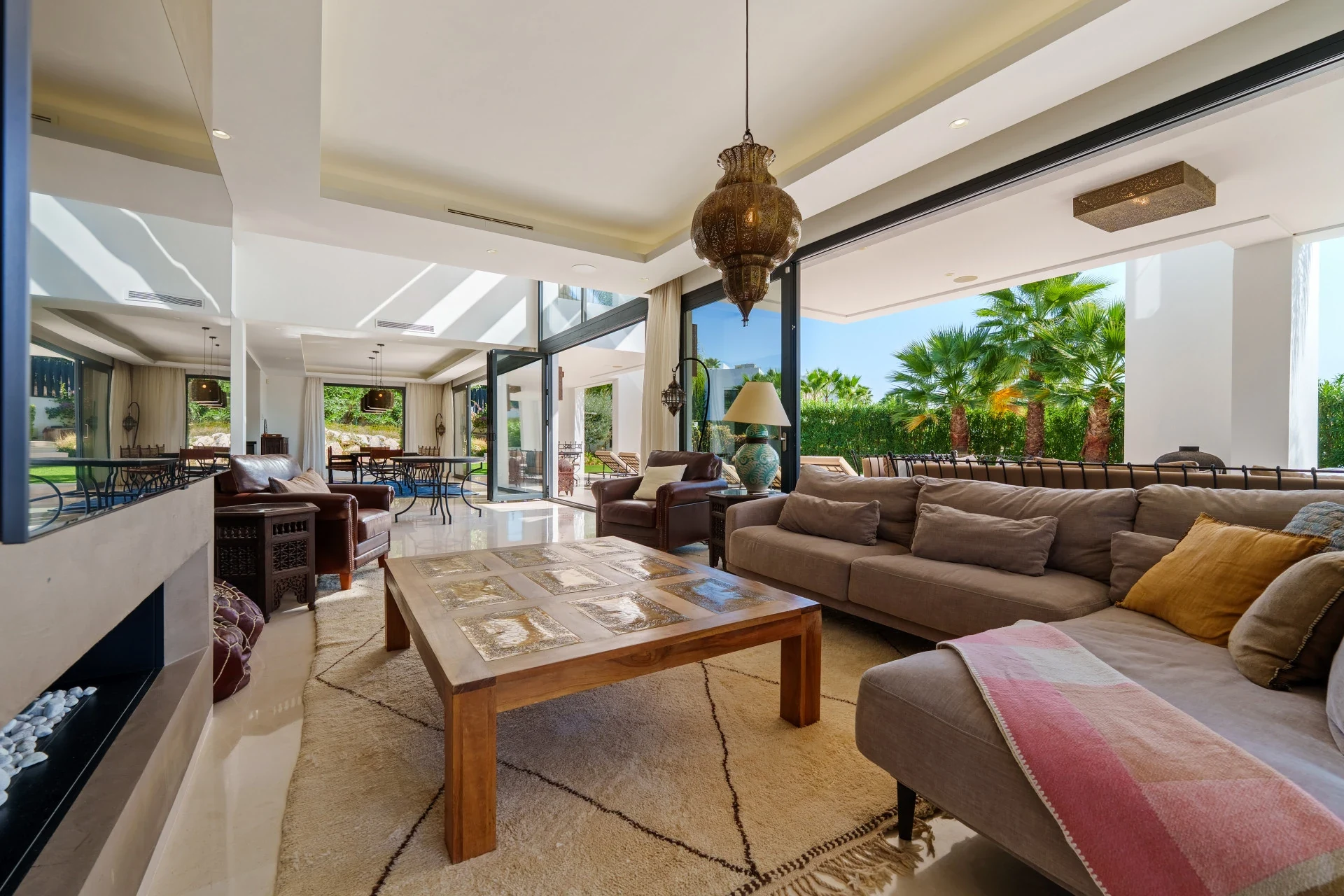 Bright living room with fireplace and terrace doors