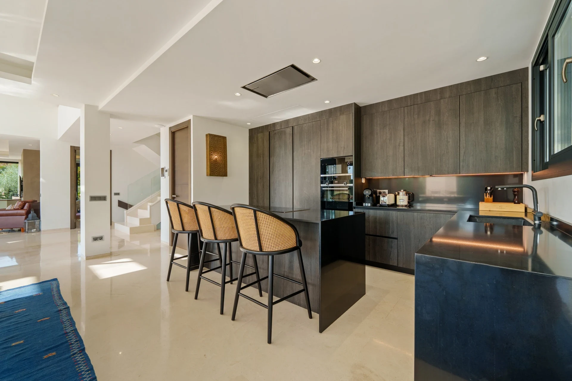 Modern fitted kitchen with breakfast bar