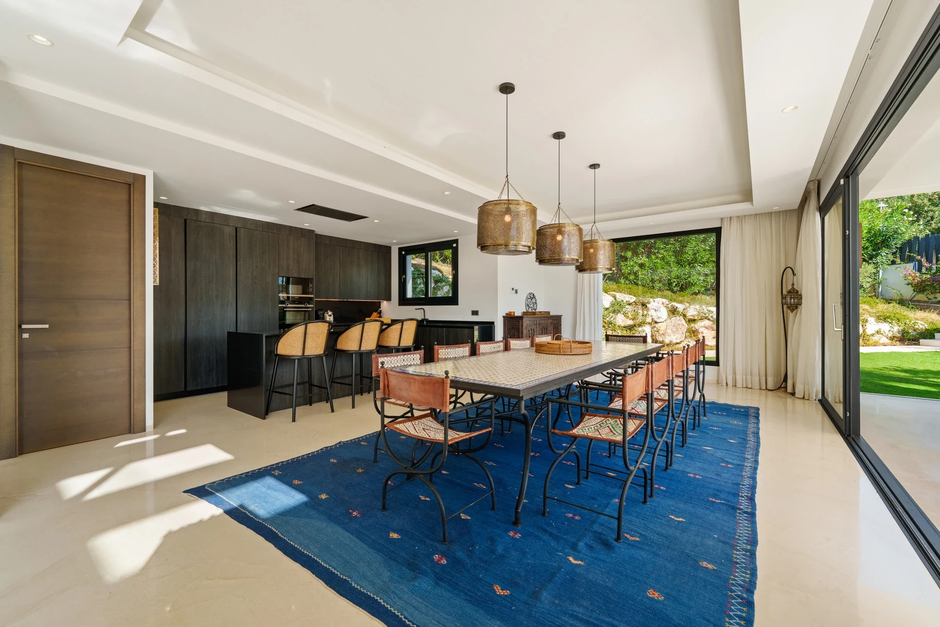 Open-plan dining area beside the kitchen and garden