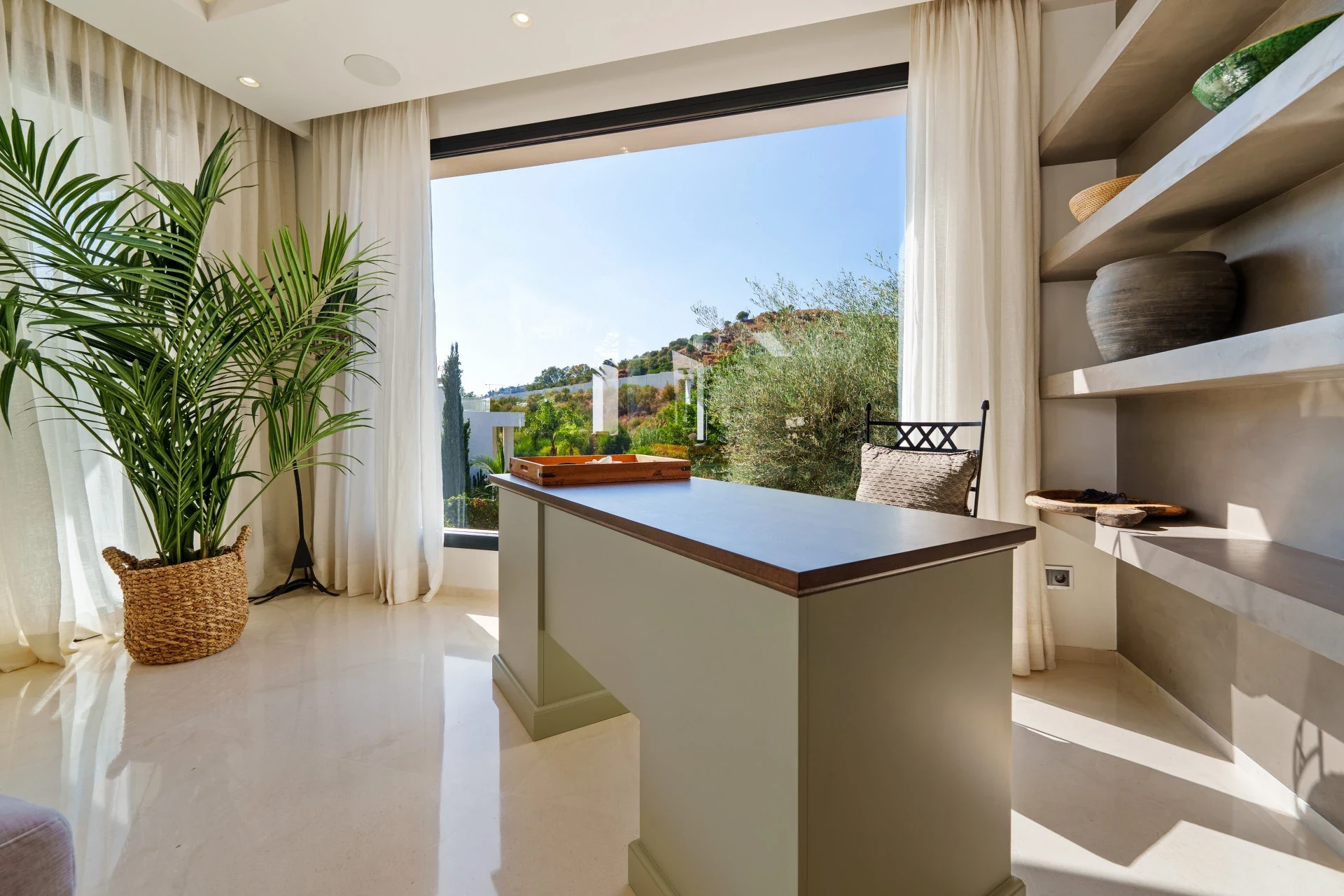 Home workspace beside a large window