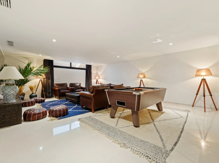 Entertainment room with games table and seating