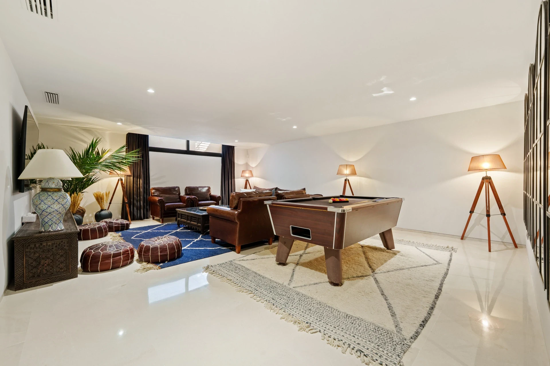 Entertainment room with games table and seating