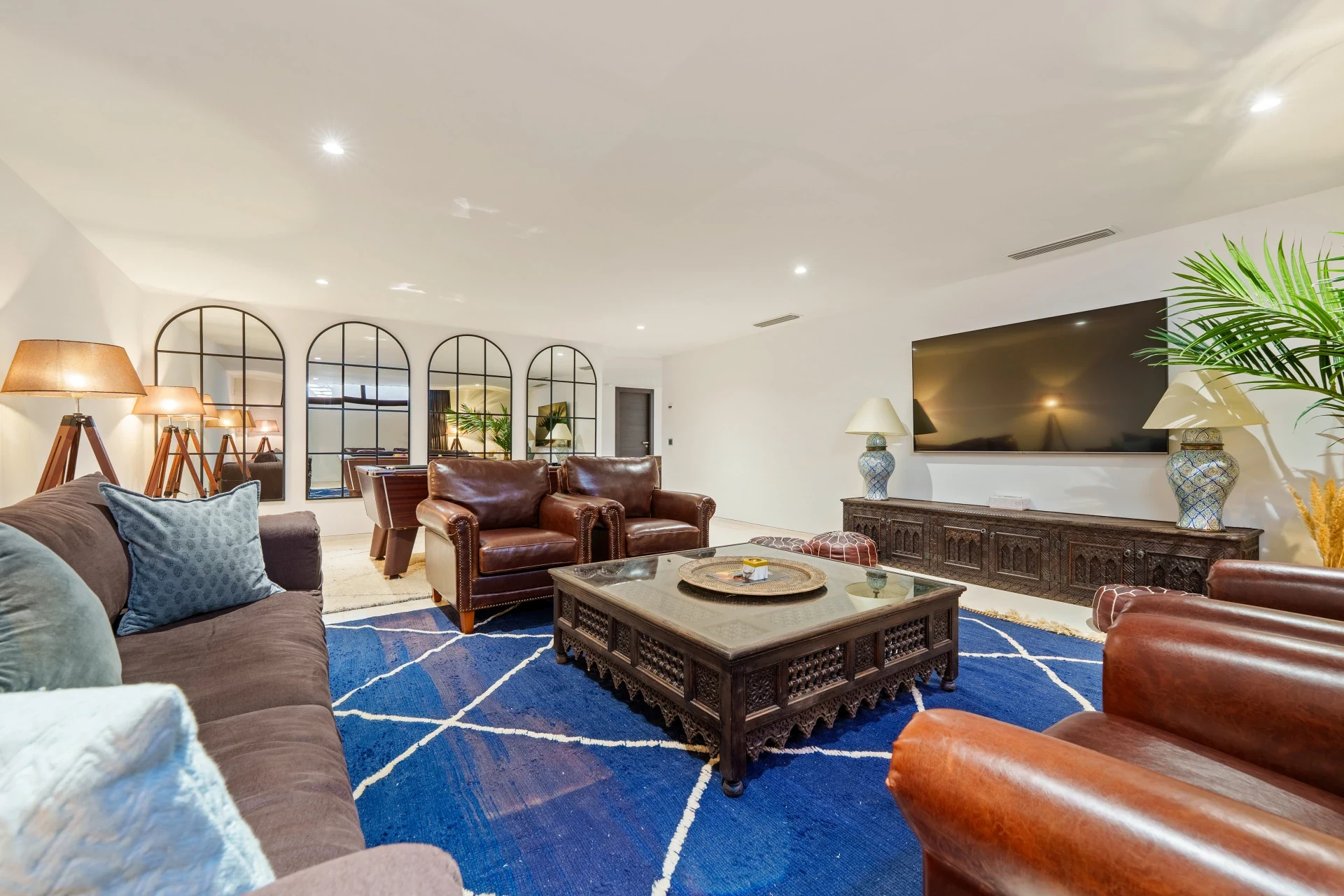 Cinema lounge with large screen and comfortable seating