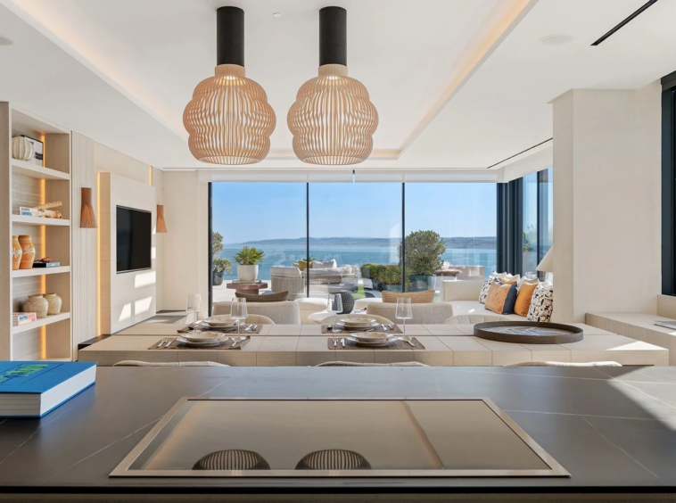 Open-plan dining and living space with sea views
